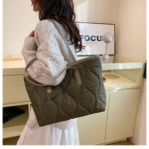 Detailed wave quilted nylon puffer tote bag in olive green with slim shoulder straps