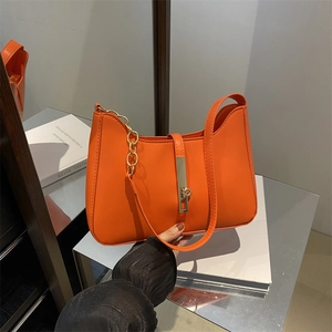Chic orange leather shoulder bag with gold chain and metal buckle for women