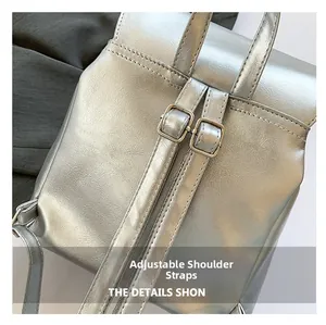 Detail of adjustable silver backpack straps with polished square metal buckles