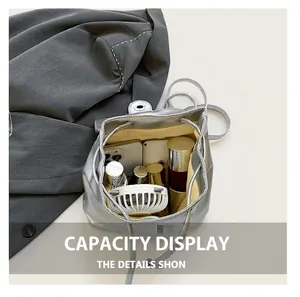 Internal view of silver metallic drawstring bucket bag showing spacious storage capacity