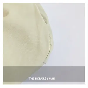 Close-up of premium cream pleated fabric texture and professional stitching details