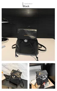 Detail of black faux leather bucket backpack with drawstring and silver twist lock