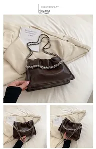 Detail view of Havana brown crackle-effect chain bag with stylish wrinkled leather design