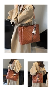 Close-up of caramel checkered tote bag with chain strap and baseball charm