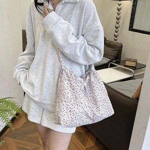 Floral canvas tote bag with drawstring closure and large capacity for casual style