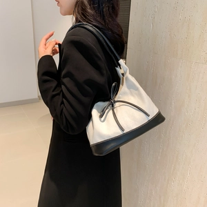 Chic black and white bow tote bag with contrast leather trim for daily casual shoulder wear