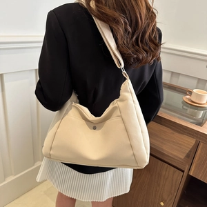 Vintage large capacity beige tote bag for women featuring a minimalist solid color design