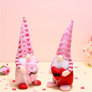 Detailed view of pink Valentine's Day gnomes with plush hearts and cute teddy bear dolls