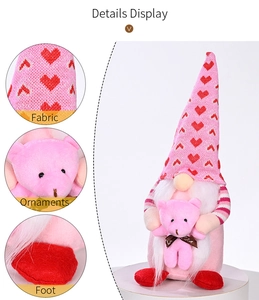 Detail display of pink Valentine gnome showing fabric textures and heart ornament