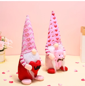 Close-up of plush Valentine Gnomes with red hearts and pink teddy bear in a festive setting