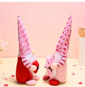 Detail of pink Valentine's Gnomes featuring heart patterns and a mini teddy bear toy
