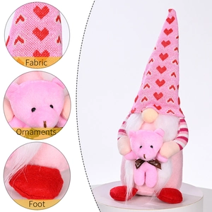 Pink Valentine's Day Gnome plush with heart hat and small bear on white stand