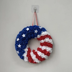 Detail of USA Independence Day wreath featuring red white and blue foam roses with stars