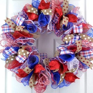 Detail of USA Independence Day wreath with red, white, and blue mesh and star ribbons