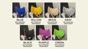 Detail view of V-quilted faux leather hobo bags in blue yellow grey and black tones
