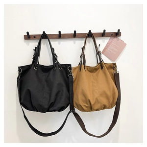 Japanese retro canvas tote bag in black and yellow with adjustable straps for daily use