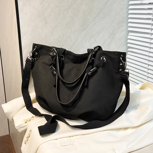 Black large capacity canvas tote bag with multi-strap design for shoulder or crossbody use