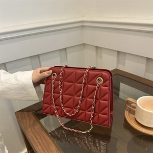 Chic red quilted leather crossbody bag with elegant gold chain strap for women