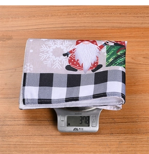 Christmas forest gnome placemat weighing 37.8g on a scale for festive table decor