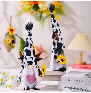 Detail of bee festival gnomes with cow print hats and sunflowers in a cozy home setting