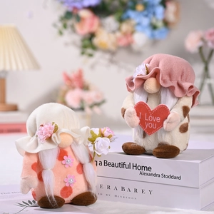 Pink and leopard print Valentine's Day gnome dolls with heart and flower bouquet decorations
