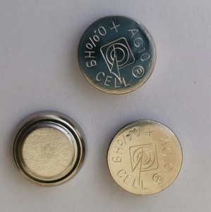 Detail shot of AG10 button cell batteries showing silver metallic finish and 0%Hg mark