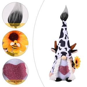 Cow print gnome plush with horns and sunflower featuring detailed product close-ups