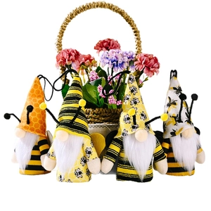 Set of four honey bee gnomes with striped hats and spring antennae for spring decor