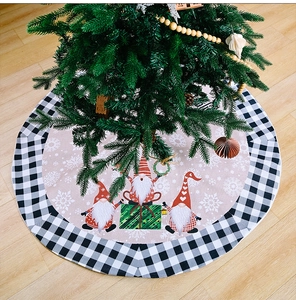 Macro detail of round beige Christmas tree skirt with festive gnomes and buffalo check border