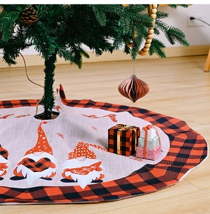 Close-up of a 1.2m gnome tree skirt with red plaid edges and Merry Christmas text
