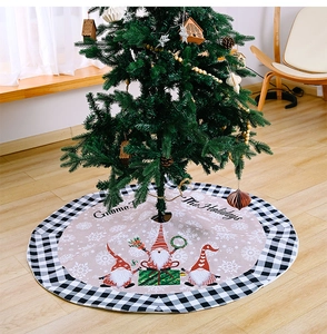 Detail of 1.2m pink Christmas tree skirt with festive gnomes and black white checkered border