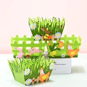 Detailed macro view of felt Easter baskets with rabbits and chickens decorations