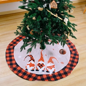 Round Christmas tree skirt with red plaid border and festive forest gnome patterns