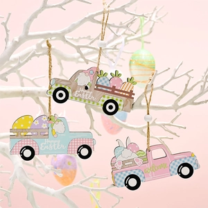 Detail of wooden Easter truck ornaments with rabbits and eggs hanging on white branches