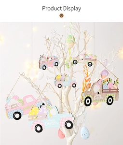 Detail of wooden Easter truck ornaments hanging with jute twine on a decorative white tree
