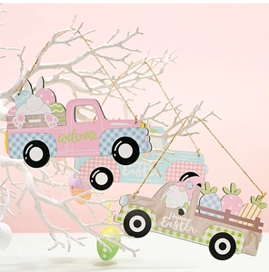 Detail of wooden Easter truck pendant with gnome and bunny hanging on white branch