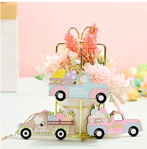 Detailed view of three wooden Easter car pendants with bunnies and eggs designs