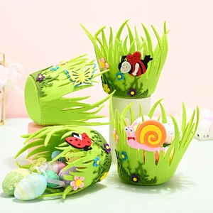 Detail of four green felt Easter baskets with bug appliques and colorful eggs
