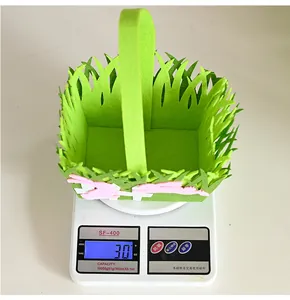 Detail showing the lightweight 30g weight of the green felt Easter basket with pink bunny
