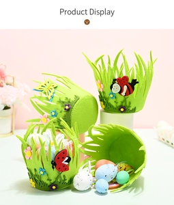 Close-up of green felt Easter basket with 3D butterfly decor and colorful painted eggs