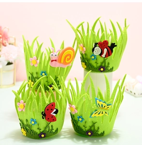 Close-up of four felt Easter baskets featuring cartoon snail, bee, ladybug, and butterfly