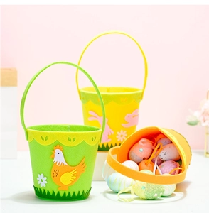 Close-up of Easter felt gift baskets with colorful eggs and cartoon bunny and hen patterns