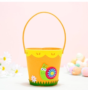 Detail of felt Easter bucket featuring a green snail and white daisy on orange background