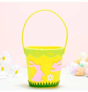 Detail of Easter felt basket with yellow bunny design and scalloped green trim