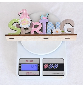 Weight measurement of a wooden SPRING sign with gnomes and pastel patterns