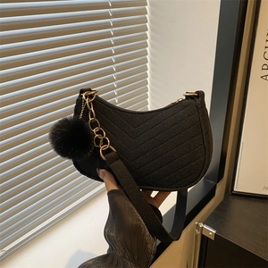 Chic black hobo shoulder bag with V-quilted texture and elegant gold chain detail