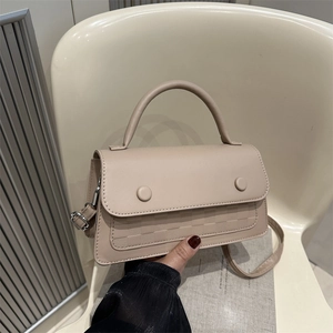 Beige checkerboard embossed crossbody bag with top handle and silver hardware