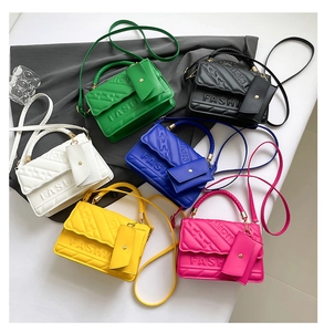 Flat lay of colorful fashion crossbody bags with FASHION logo and mini coin purses