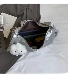 Spacious interior of silver metallic backpack showing tablet and daily essentials storage