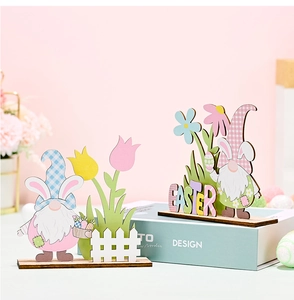 Close-up of Easter gnome wooden table ornaments with flowers and white fence decor